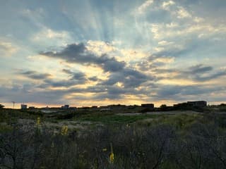 Zon achter wolken