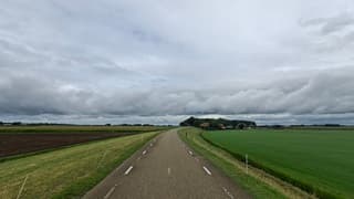 Buienwolken lijn boven de Kuinderdijk 