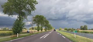 Wisselend bewolkt zon regen 