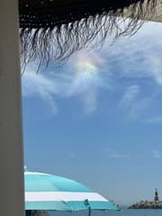 Regenboogwolk Benamaldena Spanje gefotografeerd door Xavier Ruperink op 13/08/24