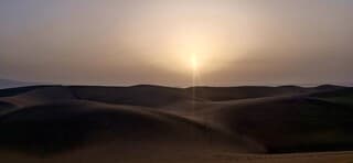 Zonsopkomst boven de duinen van Maspalomas, Gran Canaria