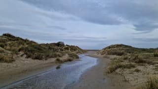 Toenemende bewolking boven de Slufter 