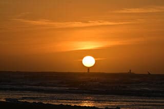 zonsondergang aan het strand
