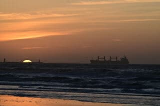 zonsondergang aan het strand