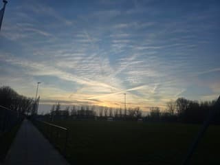 Wolken boven voetbalveld GRC'14