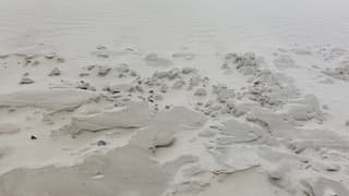 Opgewaaid nat zand 